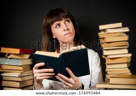 girl thoughtfully reading a book (the scene on the day of the writer)
