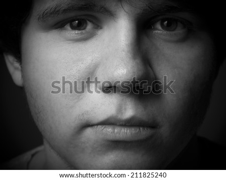 Close up portrait of young man. Black and white.