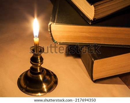 The books, candle and paper