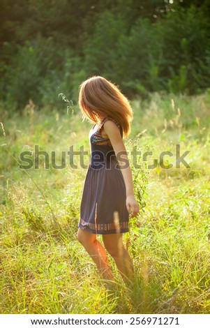 girl on the nature turns around