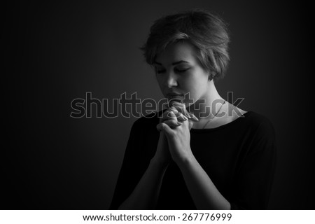 Repentance and prayer. Black and white portrait