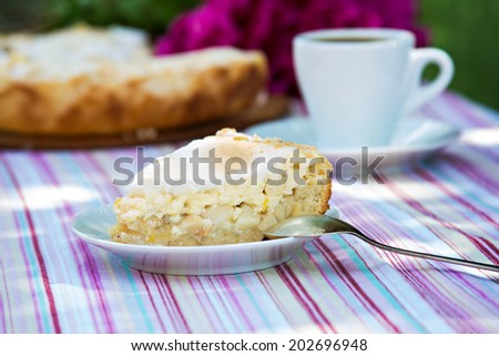 piece of pie on a white plate, pie and a cup of coffe