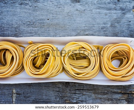 Fresh Pasta in box on the wooden table