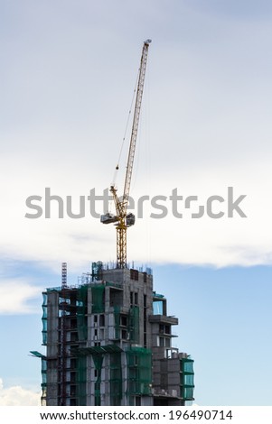 crane on the top of building in construction site