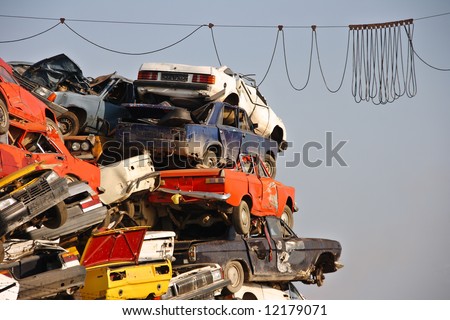 stock photo Pile of used cars in junkyard ready for salvage