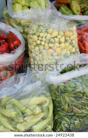 Nylon bags with vegetables on the market