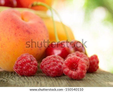 Fresh Ripe Sweet Fruits on the Wooden Table. Fresh Organic Food. White Background