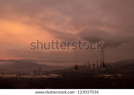 Factory with smoke during the sunrise