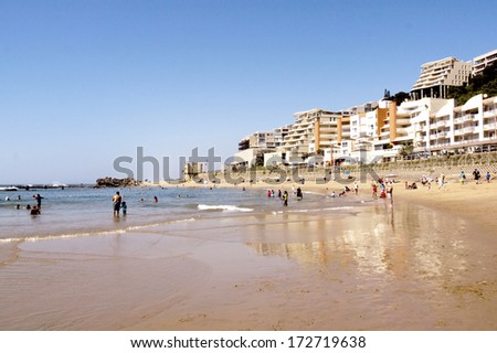 DURBAN, SOUTH AFRICA -  DECEMBER 12, 2013: Holiday makers on Umdloti beach  on December 12, 2013 in Durban, South Africa