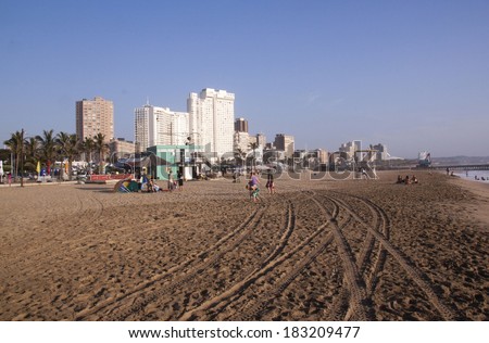 DURBAN, SOUTH AFRICA - MARCH 22, 2014: Many people and children on  North Beach Beachfront in Durban South Africa.
