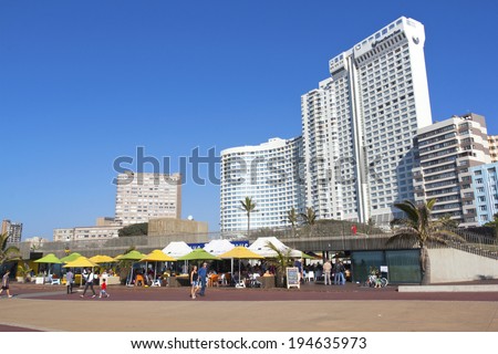 DURBAN, SOUTH AFRICA - MAY 24, 2014: Many people enjoy food and refreshments at promenade restaurant on Beachfront in Durban South Africa