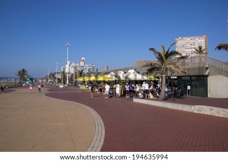 DURBAN, SOUTH AFRICA - MAY 24, 2014: Many people enjoy food and refreshments at promenade restaurant on Beachfront in Durban South Africa