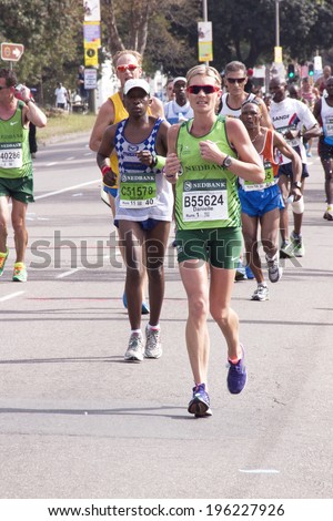 DURBAN, SOUTH AFRICA - JUNE 1, 2014: Runners competing in the long distance Comrades Ultra Marathon between Pietermaritzburg and Durban in South Africa.