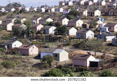 DURBAN, SOUTH AFRICA - JULY 21, 2014: View of low cost township houses fitted with solar heating at Verulam in Durban, South Africa