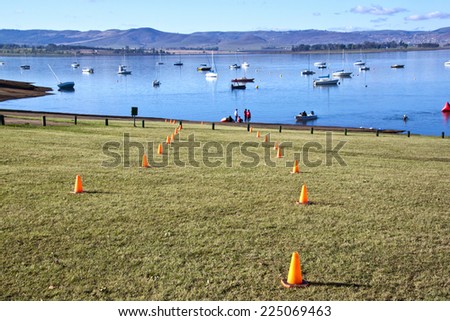 HOWICK, KWAZULU NATAL, SOUTH AFRICA - OCTOBER 19, 2014: Early Morning organisers set out the coarse for On Line Tri Series Race 1 triathlon at Midmar Dam in the Natal midlands