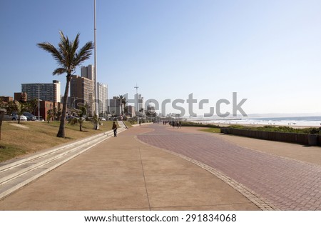 DURBAN, SOUTH AFRICA - JUNE 7, 2015: Many unknown people on beach front promenade in Durban, South Africa
