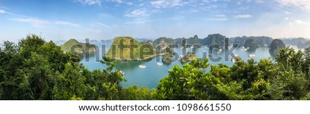 Panorama of Ha Long Bay islands, tourist boat and seascape, Ha Long, Vietnam.
