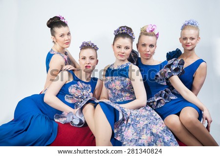 Five young girls looking forward, white background