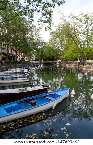 Boats line the Thiou Canal in Annecy during the Summer.