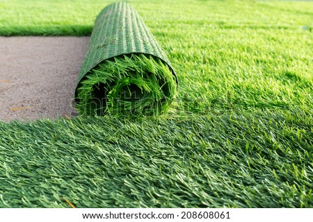 Green artificial grass soccer field