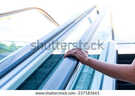 hands on Escalator to a better future