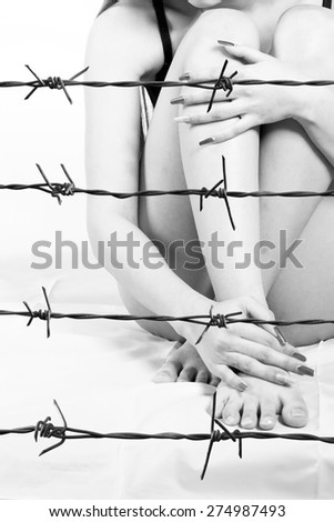 young woman and Rusty barbed wire