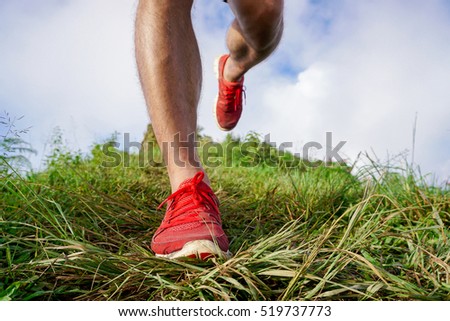 close-up Foot athlete Trail running workout on rocky terrain outdoors for fitness and healthy lifestyle