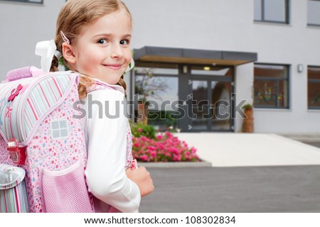Back to school -  lovely schoolgirl on the way to the school
