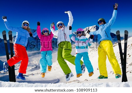 Ski, snow  and winter fun - happy family ski team