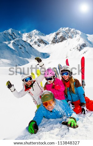 Ski, snow, sun and winter fun -  happy family ski team