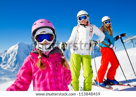 Skiing, winter - skiers on mountainside