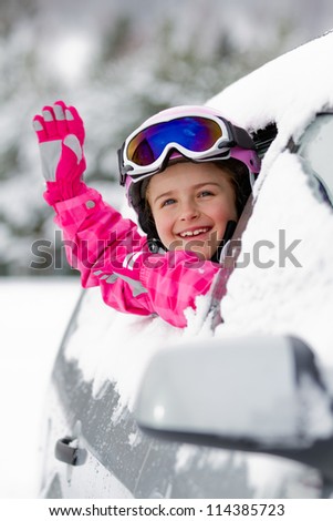 Winter holiday, ski, travel - happy child on the road for winter holidays
