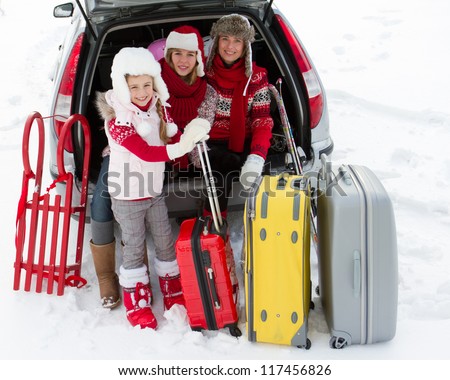 Winter holidays, ski, travel - family with baggage ready for the travel for winter holidays