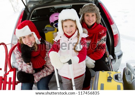 Winter, ski holidays, travel - family with baggage ready for the travel for winter holidays