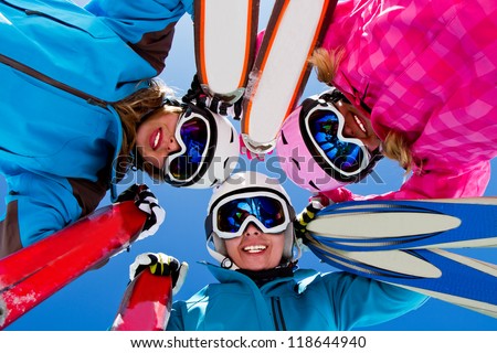 Skiing, winter, snow, sun and fun - female skiers enjoying winter vacations