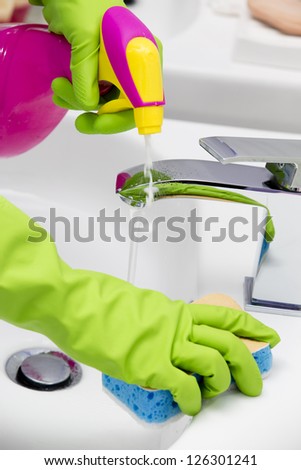 Cleaning - Cleaning Bathroom Sink With Spray Detergent - Housework, Spring Cleaning Concept