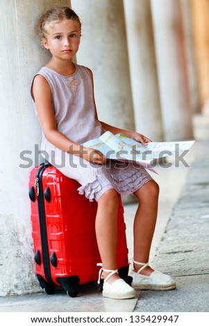 Touring Venice - lovely girl with the street plan in Venice, travel concept