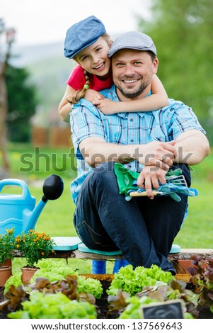 Gardening, Planting, Cultivation - Young Girl With Father Working In Vegetable Garden