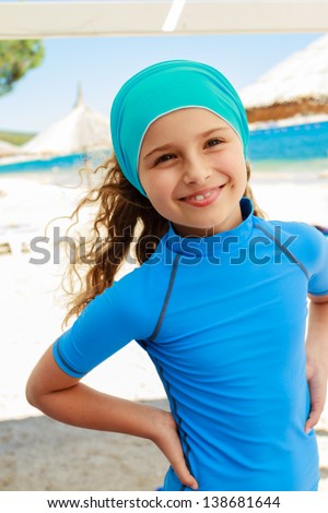 Summer vacation, summer joy - lovely surfer girl in the beach resort, active child concept