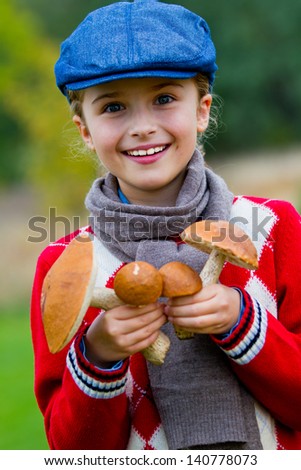 Mushrooms picking, season for mushrooms - lovely girl with basket of picked fresh edible mushrooms