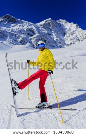 Skiing, skier, winter sport, winter fun - woman has fun on ski