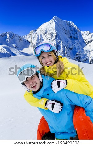 Skiing, winter sports -  young skiers having fun on ski
