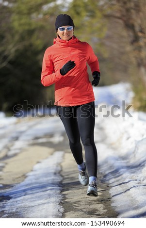 Winter running exercise woman Healthy lifestyle active woman concept Winter running exercise woman Healthy lifestyle active woman concept