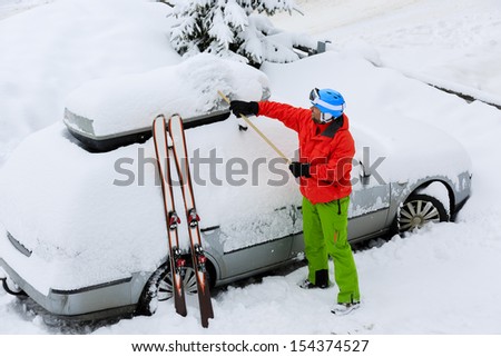 Ski, Winter, snow, car - skier man is shoveling the car of snow