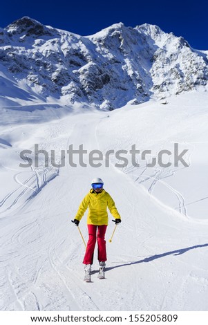 Ski, skier, winter sport - woman skiing downhill