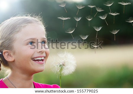 Summer Joy - Lovely Girl Blowing Dandelion