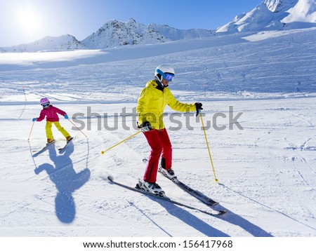 Skiing, winter, ski lesson - skiers on ski run