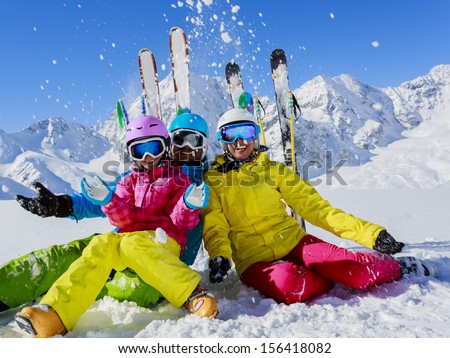 Ski, winter, snow,  skiers, sun and fun - family enjoying winter vacations