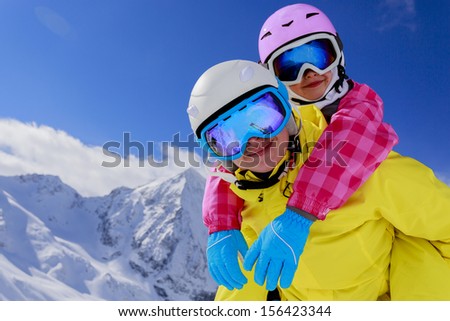 Ski, skier, snow and fun  - family enjoying winter vacations