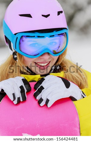 Snowboarding, Winter sports - portrait of young snowboarder girl